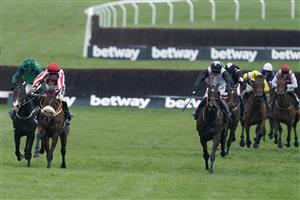 CHELTENHAM, ENGLAND - MARCH 15: Sam Twiston-Davies riding The Real Whacker (red/white) clear the last to win The Brown Advisory Novices' Chase during day two of the Cheltenham Festival 2023 at Cheltenham Racecourse on March 15, 2023 in Cheltenham, England. (Photo by Alan Crowhurst/Getty Images)