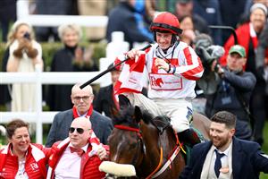 CHELTENHAM, ENGLAND - MARCH 15: Sam Twiston-Davies riding The Real Whacker celebrates winning the Brown Advisory Novices' Chase during day two of the Cheltenham Festival 2023 at Cheltenham Racecourse on March 15, 2023 in Cheltenham, England. (Photo by Michael Steele/Getty Images)