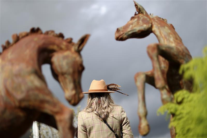 CHELTENHAM, ENGLAND - MARCH 17: Racegoers arrive ahead of day four of the Cheltenham Festival 2023 at Cheltenham Racecourse on March 17, 2023 in Cheltenham, England. (Photo by Ryan Pierse/Getty Images)