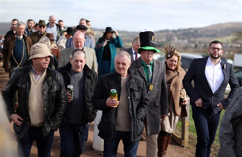 CHELTENHAM, ENGLAND - MARCH 17: Racegoers arrive ahead of day four of the Cheltenham Festival 2023 at Cheltenham Racecourse on March 17, 2023 in Cheltenham, England. (Photo by Ryan Pierse/Getty Images)