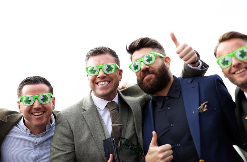 CHELTENHAM, ENGLAND - MARCH 17: Racegoers pose for a photo during day four of the Cheltenham Festival 2023 at Cheltenham Racecourse on March 17, 2023 in Cheltenham, England. (Photo by Ryan Pierse/Getty Images)
