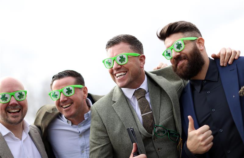 CHELTENHAM, ENGLAND - MARCH 17: Racegoers pose for a photo during day four of the Cheltenham Festival 2023 at Cheltenham Racecourse on March 17, 2023 in Cheltenham, England. (Photo by Ryan Pierse/Getty Images)