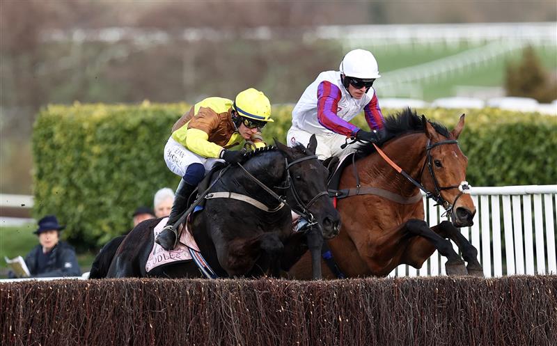 CHELTENHAM, ENGLAND - MARCH 17: Paul Townend on board Galopin Des Champs (L) jumps the last ahead of Harry Cobden on board Bravemansgame on their way to winning the Boodles Cheltenham Gold Cup Chase during day four of the Cheltenham Festival 2023 at Cheltenham Racecourse on March 17, 2023 in Cheltenham, England. (Photo by Ryan Pierse/Getty Images)