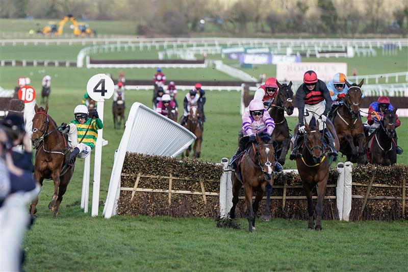 CHELTENHAM, ENGLAND - MARCH 17: Mark Walsh riding Corbetts Cross (L, green/gold) smash through the wing of the last hurdle when challenging for the lead during The Albert Bartlett Novices' Hurdle during day four of the Cheltenham Festival 2023 at Cheltenham Racecourse on March 17, 2023 in Cheltenham, England. (Photo by Alan Crowhurst/Getty Images)