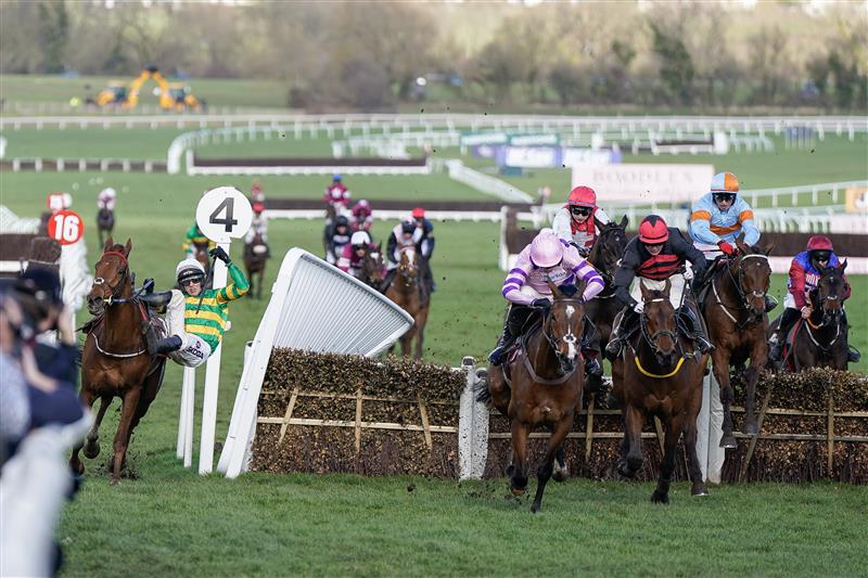 CHELTENHAM, ENGLAND - MARCH 17: Mark Walsh riding Corbetts Cross (L, green/gold) smash through the wing of the last hurdle when challenging for the lead during The Albert Bartlett Novices' Hurdle during day four of the Cheltenham Festival 2023 at Cheltenham Racecourse on March 17, 2023 in Cheltenham, England. (Photo by Alan Crowhurst/Getty Images)