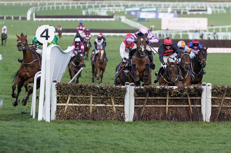 CHELTENHAM, ENGLAND - MARCH 17: Mark Walsh riding Corbetts Cross (L, green/gold) smash through the wing of the last hurdle when challenging for the lead during The Albert Bartlett Novices' Hurdle during day four of the Cheltenham Festival 2023 at Cheltenham Racecourse on March 17, 2023 in Cheltenham, England. (Photo by Alan Crowhurst/Getty Images)