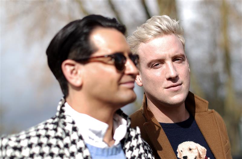 CHELTENHAM, ENGLAND - MARCH 17: Ollie Locke and Husband Gareth Locke arrive ahead of day four of the Cheltenham Festival 2023 at Cheltenham Racecourse on March 17, 2023 in Cheltenham, England. (Photo by Ryan Pierse/Getty Images)