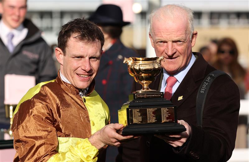 CHELTENHAM, ENGLAND - MARCH 17: Paul Townend poses alongside Trainer Willie Mullins after winning the Boodles Cheltenham Gold Cup Chase on board Galopin Des Champs during day four of the Cheltenham Festival 2023 at Cheltenham Racecourse on March 17, 2023 in Cheltenham, England. (Photo by Ryan Pierse/Getty Images)