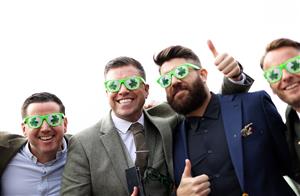 CHELTENHAM, ENGLAND - MARCH 17: Racegoers pose for a photo during day four of the Cheltenham Festival 2023 at Cheltenham Racecourse on March 17, 2023 in Cheltenham, England. (Photo by Ryan Pierse/Getty Images)