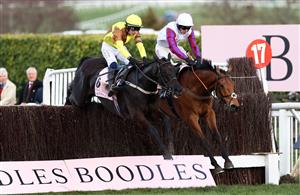 CHELTENHAM, ENGLAND - MARCH 17: Paul Townend on board Galopin Des Champs (L) jumps the last ahead of Harry Cobden on board Bravemansgame on their way to winning the Boodles Cheltenham Gold Cup Chase during day four of the Cheltenham Festival 2023 at Cheltenham Racecourse on March 17, 2023 in Cheltenham, England. (Photo by Ryan Pierse/Getty Images)