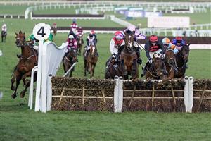 CHELTENHAM, ENGLAND - MARCH 17: Mark Walsh riding Corbetts Cross (L, green/gold) smash through the wing of the last hurdle when challenging for the lead during The Albert Bartlett Novices' Hurdle during day four of the Cheltenham Festival 2023 at Cheltenham Racecourse on March 17, 2023 in Cheltenham, England. (Photo by Alan Crowhurst/Getty Images)