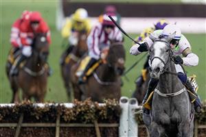 CHELTENHAM, ENGLAND - MARCH 17: Paul Townend riding Lossiemouth (pink) clear the last to win The JCB Triumph Hurdle during day four of the Cheltenham Festival 2023 at Cheltenham Racecourse on March 17, 2023 in Cheltenham, England. (Photo by Alan Crowhurst/Getty Images)
