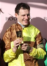 CHELTENHAM, ENGLAND - MARCH 17: Paul Townend poses after winning the Boodles Cheltenham Gold Cup Chase on board Galopin Des Champs during day four of the Cheltenham Festival 2023 at Cheltenham Racecourse on March 17, 2023 in Cheltenham, England. (Photo by Ryan Pierse/Getty Images)