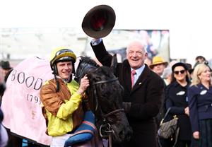 CHELTENHAM, ENGLAND - MARCH 17: Paul Townend poses alongside Trainer Willie Mullins after winning the Boodles Cheltenham Gold Cup Chase on board Galopin Des Champs during day four of the Cheltenham Festival 2023 at Cheltenham Racecourse on March 17, 2023 in Cheltenham, England. (Photo by Ryan Pierse/Getty Images)