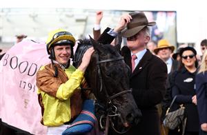 CHELTENHAM, ENGLAND - MARCH 17: Paul Townend poses alongside Trainer Willie Mullins after winning the Boodles Cheltenham Gold Cup Chase on board Galopin Des Champs during day four of the Cheltenham Festival 2023 at Cheltenham Racecourse on March 17, 2023 in Cheltenham, England. (Photo by Ryan Pierse/Getty Images)
