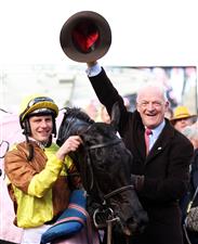 CHELTENHAM, ENGLAND - MARCH 17: Paul Townend poses alongside Trainer Willie Mullins after winning the Boodles Cheltenham Gold Cup Chase on board Galopin Des Champs during day four of the Cheltenham Festival 2023 at Cheltenham Racecourse on March 17, 2023 in Cheltenham, England. (Photo by Ryan Pierse/Getty Images)