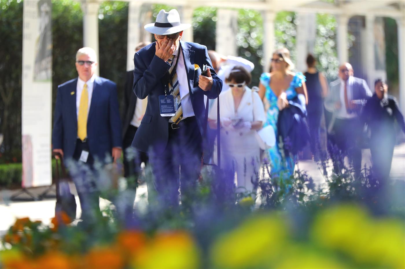 SYDNEY, AUSTRALIA - MARCH 18: Racegoers arrive prior to the Longines Golden Slipper Day - Sydney Racing at Rosehill Gardens on March 18, 2023 in Sydney, Australia. (Photo by Jeremy Ng/Getty Images)
