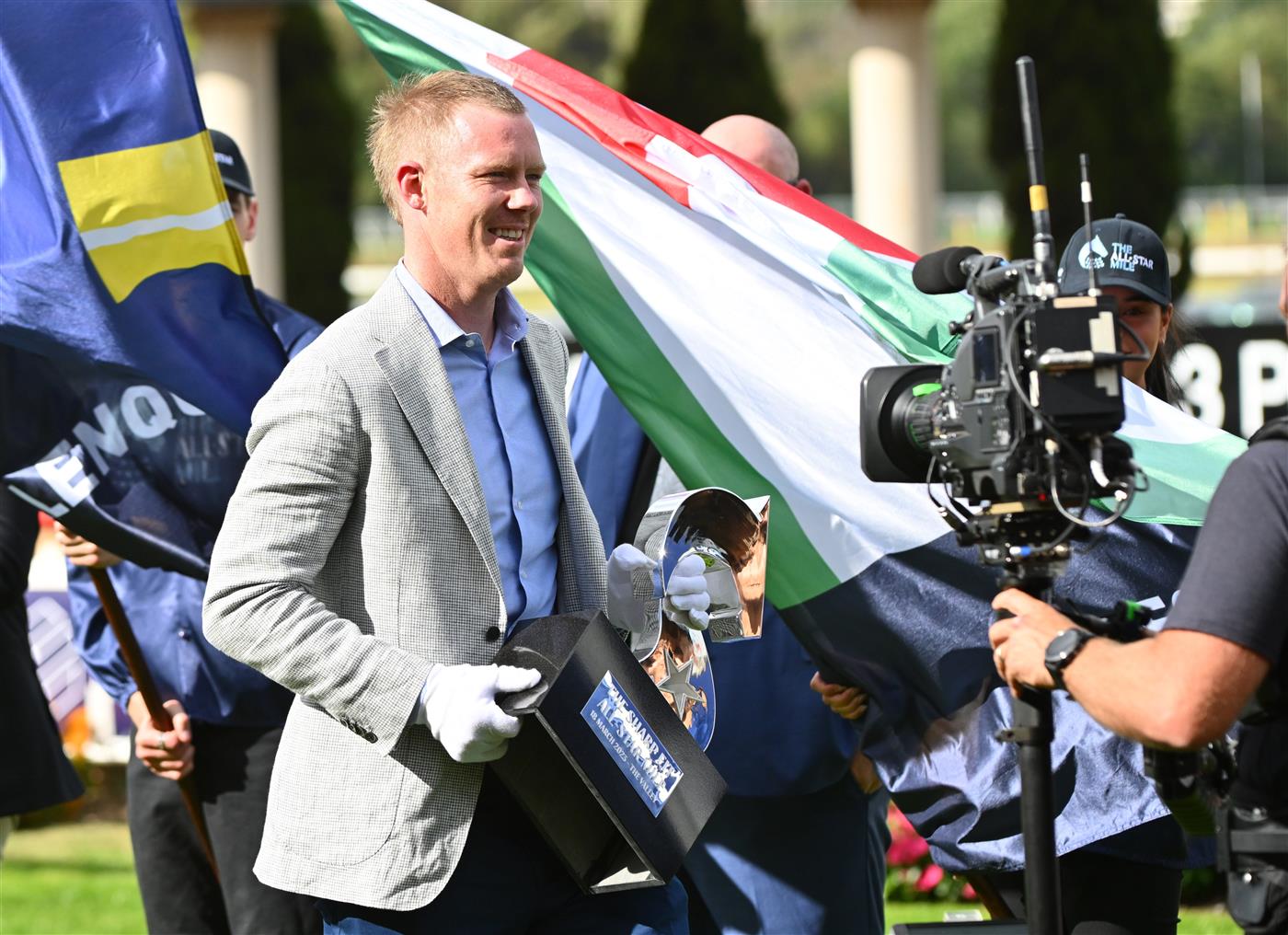 MELBOURNE, AUSTRALIA - MARCH 18: Richmond Tigers star Jack Riewoldt carries the trophy before Race 7, the The Sharp Eit All-star Mile, during Melbourne Racing at Moonee Valley Racecourse on March 18, 2023 in Melbourne, Australia. (Photo by Vince Caligiuri/Getty Images)