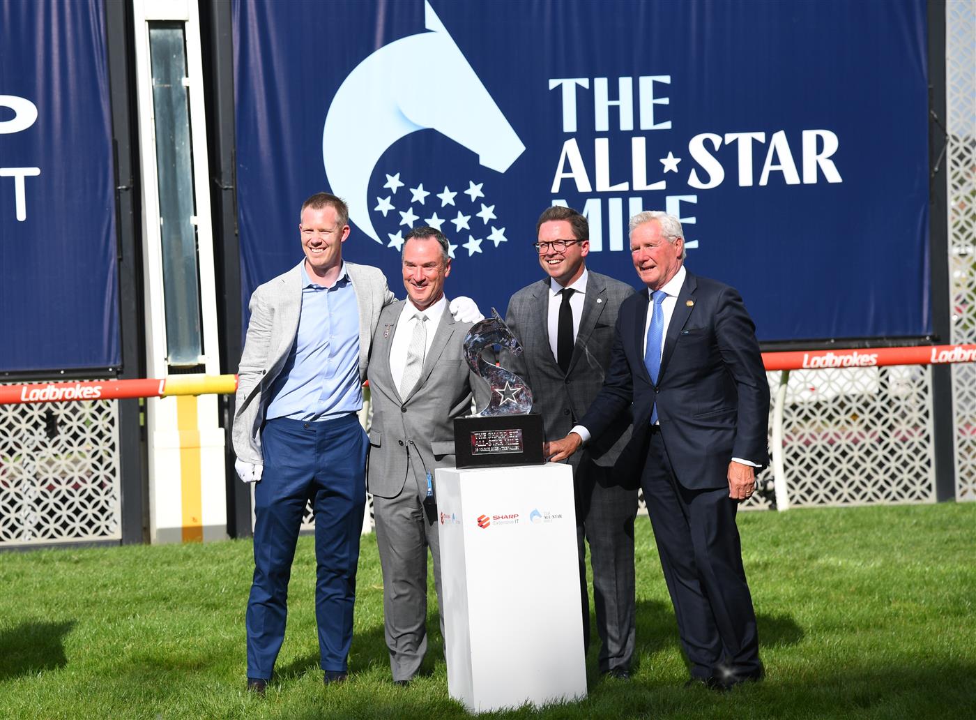 MELBOURNE, AUSTRALIA - MARCH 18: Richmond Tigers star Jack Riewoldt, Brian Kruger Chairman Racing Victoria, Anthony Carbines Minister for Racing and Don Casboult Moonee Valley Chairman pose before Race 7, the The Sharp Eit All-star Mile, during Melbourne Racing at Moonee Valley Racecourse on March 18, 2023 in Melbourne, Australia. (Photo by Vince Caligiuri/Getty Images)