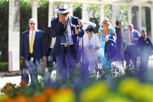 SYDNEY, AUSTRALIA - MARCH 18: Racegoers arrive prior to the Longines Golden Slipper Day - Sydney Racing at Rosehill Gardens on March 18, 2023 in Sydney, Australia. (Photo by Jeremy Ng/Getty Images)