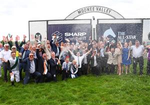 MELBOURNE, AUSTRALIA - MARCH 18: Trainer JD Hayes sprays the champagne with connections and jockey Luke Currie after Mr Brightside won Race 7, the The Sharp Eit All-star Mile, during Melbourne Racing at Moonee Valley Racecourse on March 18, 2023 in Melbourne, Australia. (Photo by Vince Caligiuri/Getty Images)