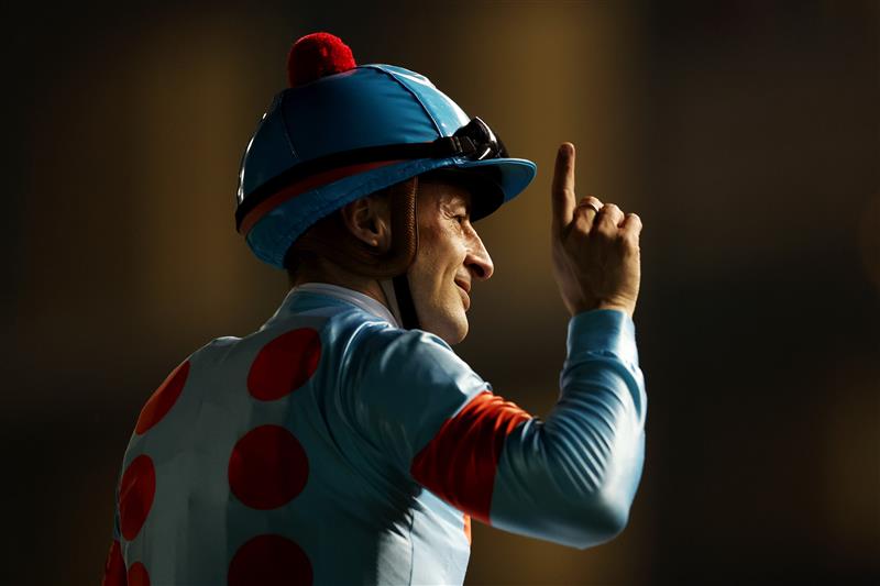 DUBAI, UNITED ARAB EMIRATES - MARCH 25: Christophe Lemaire riding Equinox celebrates winning the Longines Dubai Sheema Classic during the Dubai World Cup at Meydan Racecourse on March 25, 2023 in Dubai, United Arab Emirates. (Photo by Christopher Pike/Getty Images)