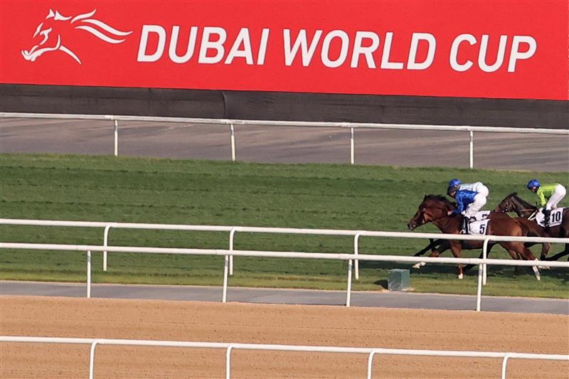Jockeys compete in the Dubai Gold Cup race during the Dubai World Cup horse racing event at the Meydan racecourse in Dubai on March 25, 2023. (Photo by Karim SAHIB / AFP) / The erroneous mention[s] appearing in the metadata of this photo by Karim SAHIB has been modified in AFP systems in the following manner: [Jockeys compete] instead of [English jockey Ryan Moore, riding on the horse "Broome"]. Please immediately remove the erroneous mention[s] from all your online services and delete it (them) from your servers. If you have been authorized by AFP to distribute it (them) to third parties, please ensure that the same actions are carried out by them. Failure to promptly comply with these instructions will entail liability on your part for any continued or post notification usage. Therefore we thank you very much for all your attention and prompt action. We are sorry for the inconvenience this notification may cause and remain at your disposal for any further information you may require. (Photo by KARIM SAHIB/AFP via Getty Images)