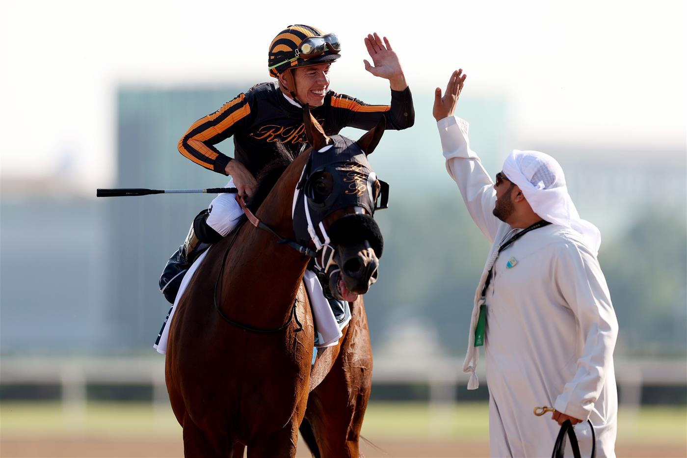 DUBAI, UNITED ARAB EMIRATES - MARCH 25: Tyler Gaffalione riding Isolate celebrates winning the Godolphin Mile during the Dubai World Cup at Meydan Racecourse on March 25, 2023 in Dubai, United Arab Emirates. (Photo by Christopher Pike/Getty Images)