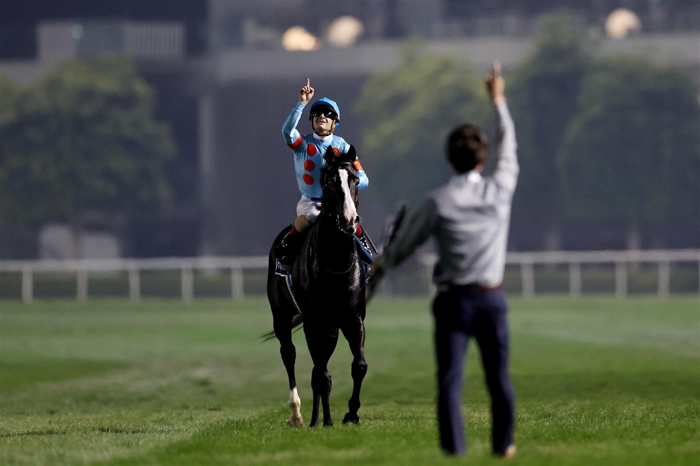 DUBAI, UNITED ARAB EMIRATES - MARCH 25: Christophe Lemaire riding Equinox celebrates winning the Longines Dubai Sheema Classic during the Dubai World Cup at Meydan Racecourse on March 25, 2023 in Dubai, United Arab Emirates. (Photo by Christopher Pike/Getty Images)