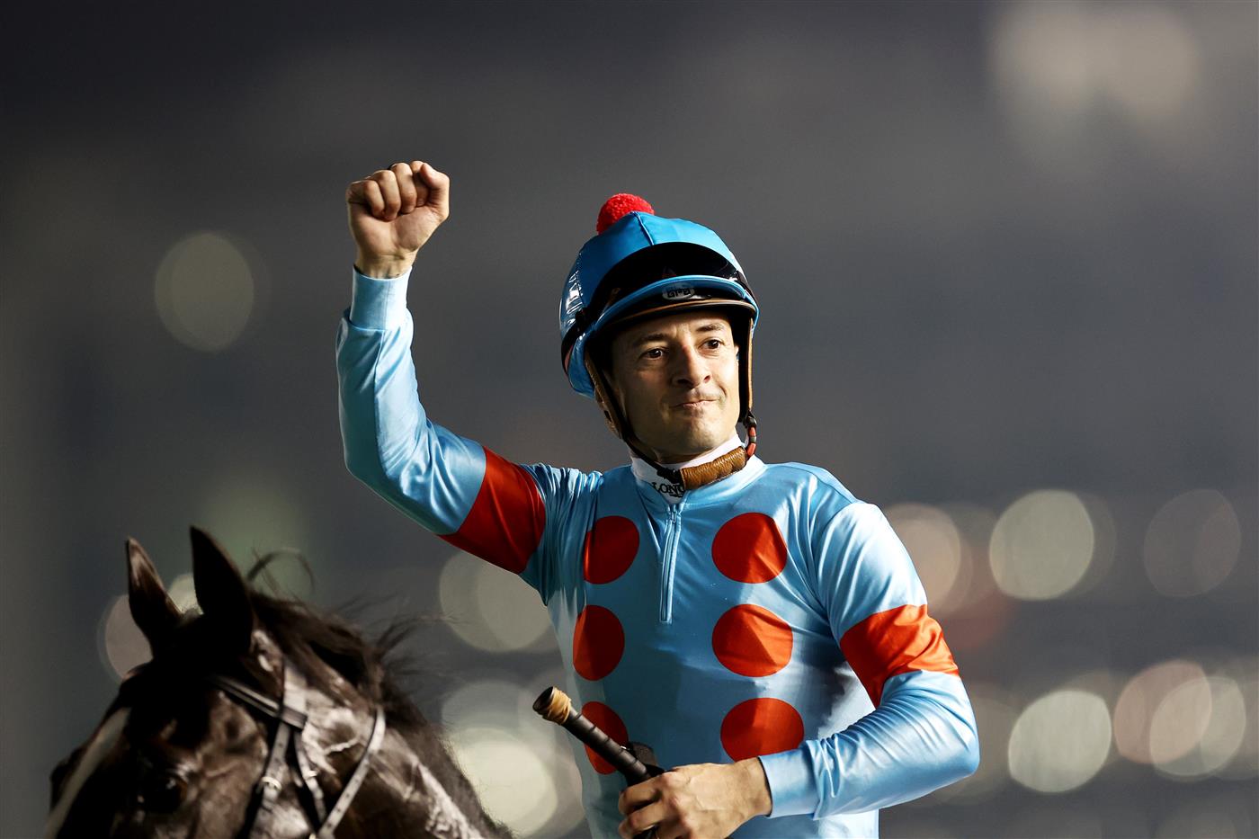 DUBAI, UNITED ARAB EMIRATES - MARCH 25: Christophe Lemaire riding Equinox celebrates winning the Longines Dubai Sheema Classic during the Dubai World Cup at Meydan Racecourse on March 25, 2023 in Dubai, United Arab Emirates. (Photo by Christopher Pike/Getty Images)