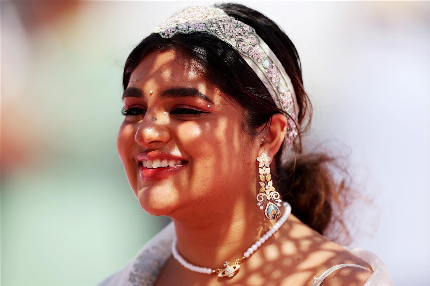 DUBAI, UNITED ARAB EMIRATES - MARCH 25: A racegoer looks on during the Dubai World Cup at Meydan Racecourse on March 25, 2023 in Dubai, United Arab Emirates. (Photo by Christopher Pike/Getty Images)