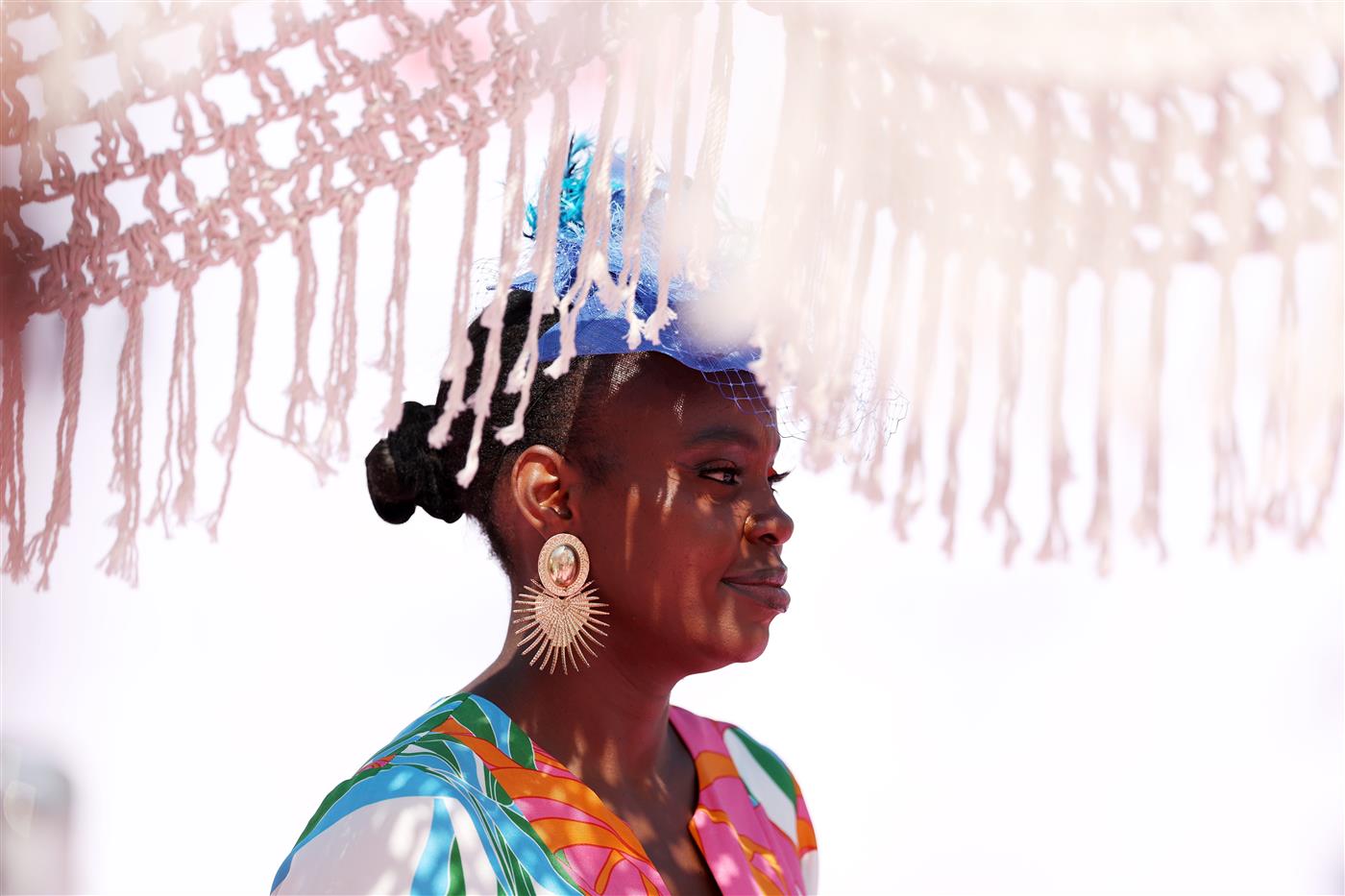 DUBAI, UNITED ARAB EMIRATES - MARCH 25: A racegoer looks on during the Dubai World Cup at Meydan Racecourse on March 25, 2023 in Dubai, United Arab Emirates. (Photo by Christopher Pike/Getty Images)