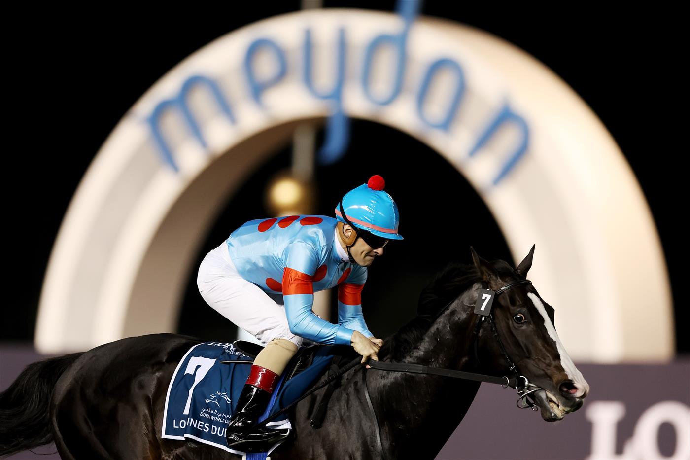 DUBAI, UNITED ARAB EMIRATES - MARCH 25: Christophe Lemaire riding Equinox wins the Longines Dubai Sheema Classic during the Dubai World Cup at Meydan Racecourse on March 25, 2023 in Dubai, United Arab Emirates. (Photo by Christopher Pike/Getty Images)