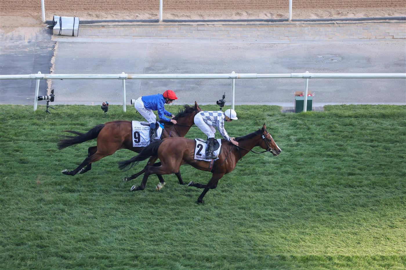 Jockey Ryan Moore on Broome (#2) overtakes William Buick on Siskany to win the Dubai World Cup horse racing event at the Meydan racecourse in Dubai on March 25, 2023. (Photo by Karim SAHIB / AFP) (Photo by KARIM SAHIB/AFP via Getty Images)