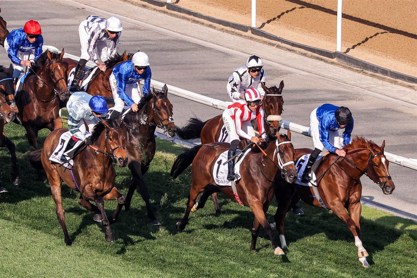 Jockeys compete in the Dubai Gold Cup race during the Dubai World Cup horse racing event at the Meydan racecourse in Dubai on March 25, 2023. (Photo by Karim SAHIB / AFP) / The erroneous mention[s] appearing in the metadata of this photo by Karim SAHIB has been modified in AFP systems in the following manner: [Jockeys compete] instead of [English jockey Ryan Moore, riding on the horse "Broome"]. Please immediately remove the erroneous mention[s] from all your online services and delete it (them) from your servers. If you have been authorized by AFP to distribute it (them) to third parties, please ensure that the same actions are carried out by them. Failure to promptly comply with these instructions will entail liability on your part for any continued or post notification usage. Therefore we thank you very much for all your attention and prompt action. We are sorry for the inconvenience this notification may cause and remain at your disposal for any further information you may require. (Photo by KARIM SAHIB/AFP via Getty Images)