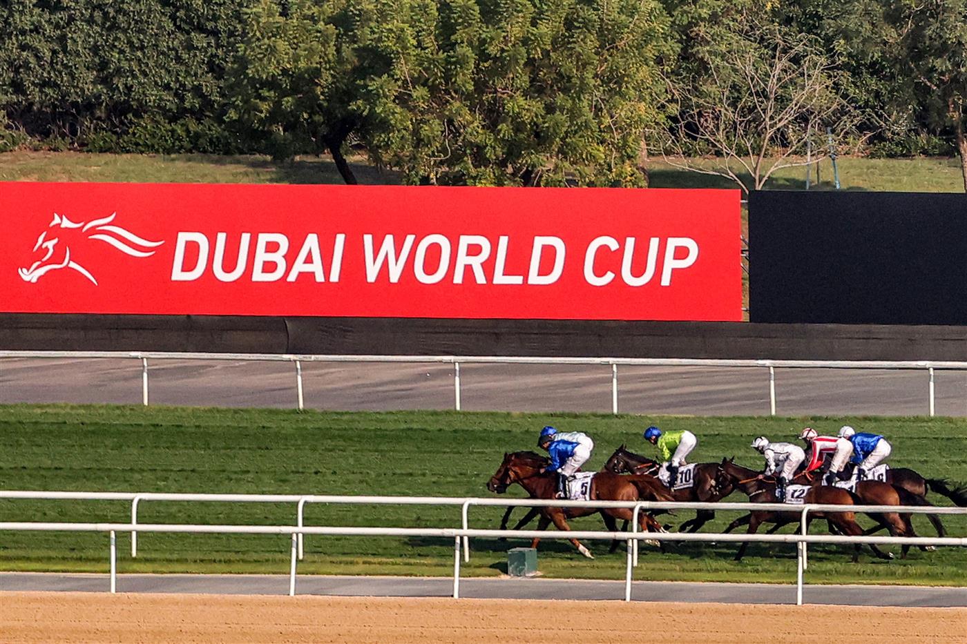 Jockeys compete in the Dubai Gold Cup race during the Dubai World Cup horse racing event at the Meydan racecourse in Dubai on March 25, 2023. (Photo by Karim SAHIB / AFP) / The erroneous mention[s] appearing in the metadata of this photo by Karim SAHIB has been modified in AFP systems in the following manner: [Jockeys compete] instead of [English jockey Ryan Moore, riding on the horse "Broome"]. Please immediately remove the erroneous mention[s] from all your online services and delete it (them) from your servers. If you have been authorized by AFP to distribute it (them) to third parties, please ensure that the same actions are carried out by them. Failure to promptly comply with these instructions will entail liability on your part for any continued or post notification usage. Therefore we thank you very much for all your attention and prompt action. We are sorry for the inconvenience this notification may cause and remain at your disposal for any further information you may require. (Photo by KARIM SAHIB/AFP via Getty Images)