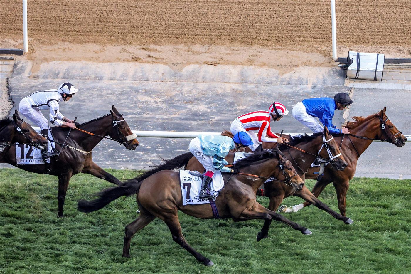Jockeys compete in the Dubai Gold Cup race during the Dubai World Cup horse racing event at the Meydan racecourse in Dubai on March 25, 2023. (Photo by Karim SAHIB / AFP) / The erroneous mention[s] appearing in the metadata of this photo by Karim SAHIB has been modified in AFP systems in the following manner: [Jockeys compete] instead of [English jockey Ryan Moore, riding on the horse "Broome"]. Please immediately remove the erroneous mention[s] from all your online services and delete it (them) from your servers. If you have been authorized by AFP to distribute it (them) to third parties, please ensure that the same actions are carried out by them. Failure to promptly comply with these instructions will entail liability on your part for any continued or post notification usage. Therefore we thank you very much for all your attention and prompt action. We are sorry for the inconvenience this notification may cause and remain at your disposal for any further information you may require. (Photo by KARIM SAHIB/AFP via Getty Images)