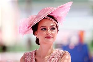 DUBAI, UNITED ARAB EMIRATES - MARCH 25: A racegoer looks on during the Dubai World Cup at Meydan Racecourse on March 25, 2023 in Dubai, United Arab Emirates. (Photo by Christopher Pike/Getty Images)
