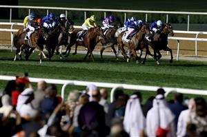 DUBAI, UNITED ARAB EMIRATES - MARCH 25: Lanfranco Dettori riding Lord North, 2nd right, wins the Dubai Turf during the Dubai World Cup at Meydan Racecourse on March 25, 2023 in Dubai, United Arab Emirates. (Photo by Christopher Pike/Getty Images)