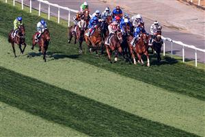 Jockeys compete in the Dubai Gold Cup race during the Dubai World Cup horse racing event at the Meydan racecourse in Dubai on March 25, 2023. (Photo by Karim SAHIB / AFP) / The erroneous mention[s] appearing in the metadata of this photo by Karim SAHIB has been modified in AFP systems in the following manner: [Jockeys compete] instead of [English jockey Ryan Moore, riding on the horse "Broome"]. Please immediately remove the erroneous mention[s] from all your online services and delete it (them) from your servers. If you have been authorized by AFP to distribute it (them) to third parties, please ensure that the same actions are carried out by them. Failure to promptly comply with these instructions will entail liability on your part for any continued or post notification usage. Therefore we thank you very much for all your attention and prompt action. We are sorry for the inconvenience this notification may cause and remain at your disposal for any further information you may require. (Photo by KARIM SAHIB/AFP via Getty Images)