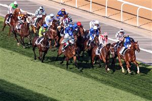 Jockeys compete in the Dubai Gold Cup race during the Dubai World Cup horse racing event at the Meydan racecourse in Dubai on March 25, 2023. (Photo by Karim SAHIB / AFP) / The erroneous mention[s] appearing in the metadata of this photo by Karim SAHIB has been modified in AFP systems in the following manner: [Jockeys compete] instead of [English jockey Ryan Moore, riding on the horse "Broome"]. Please immediately remove the erroneous mention[s] from all your online services and delete it (them) from your servers. If you have been authorized by AFP to distribute it (them) to third parties, please ensure that the same actions are carried out by them. Failure to promptly comply with these instructions will entail liability on your part for any continued or post notification usage. Therefore we thank you very much for all your attention and prompt action. We are sorry for the inconvenience this notification may cause and remain at your disposal for any further information you may require. (Photo by KARIM SAHIB/AFP via Getty Images)