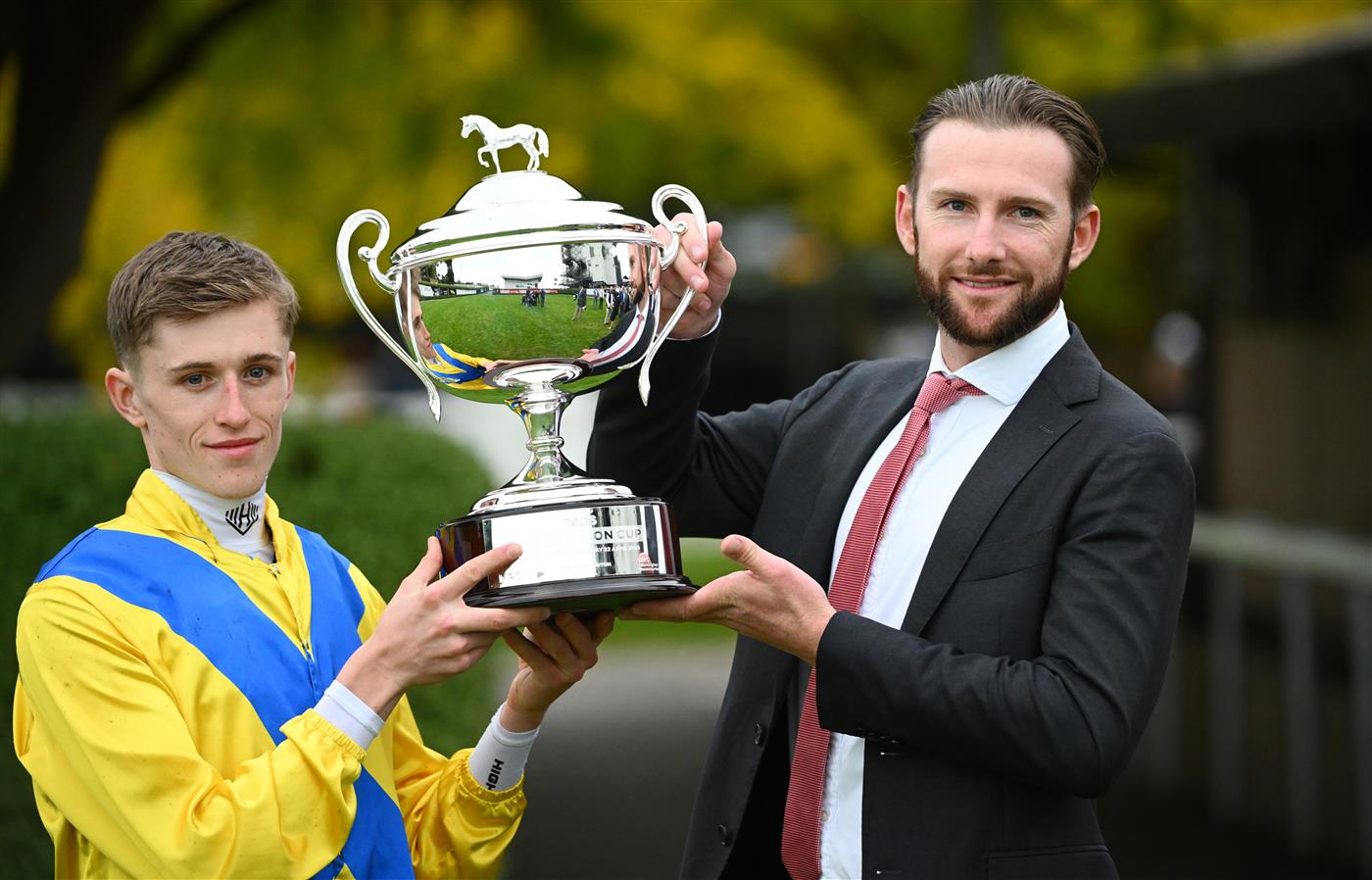 MORNINGTON, AUSTRALIA - APRIL 22: Ben Allen and Jack Turnbull (assistant trainer) pose with the trophy after Right You Are won Race 8, the Neds Mornington Cup, during Melbourne Racing at Mornington Racecourse on April 22, 2023 in Mornington, Australia. (Photo by Vince Caligiuri/Getty Images)