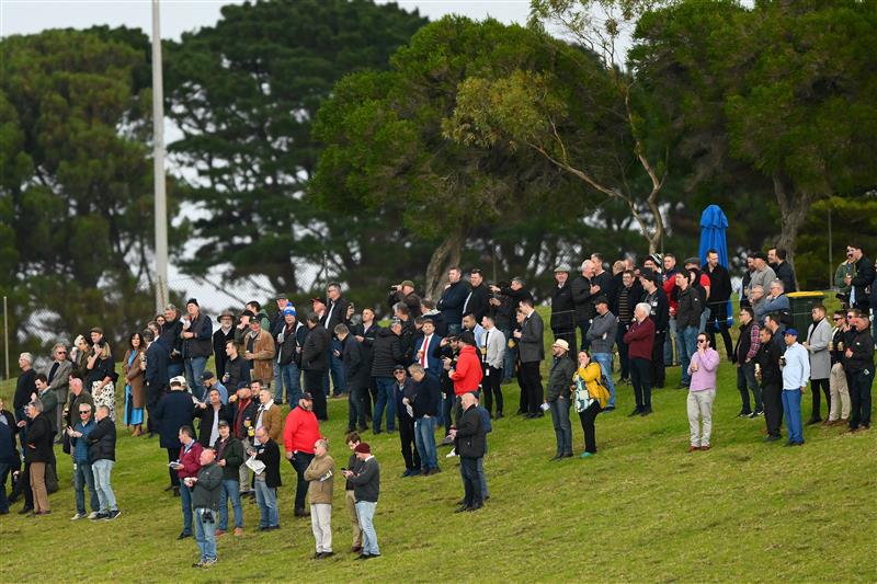WARRNAMBOOL, AUSTRALIA - MAY 02: Crowds watch the 3YB FM Scotty Stewart Brierly Steeplechase during Brierly Steeplechase day at Warrnambool Racing Club on May 02, 2023 in Warrnambool, Australia. (Photo by Morgan Hancock/Getty Images)
