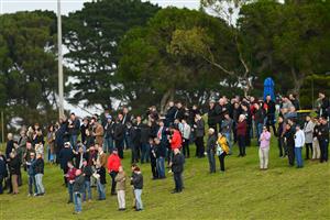 WARRNAMBOOL, AUSTRALIA - MAY 02: Crowds watch the 3YB FM Scotty Stewart Brierly Steeplechase during Brierly Steeplechase day at Warrnambool Racing Club on May 02, 2023 in Warrnambool, Australia. (Photo by Morgan Hancock/Getty Images)