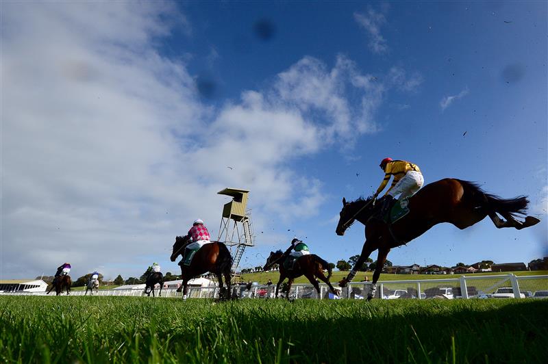 WARRNAMBOOL, AUSTRALIA - MAY 03: A general view of mud being flicked up from horses after they jumped over a hurdle in the Sovereign Resort Galleywood Hurdle during Galleywood Hurdle day at Warrnambool Racing Club on May 03, 2023 in Warrnambool, Australia. (Photo by Morgan Hancock/Getty Images)