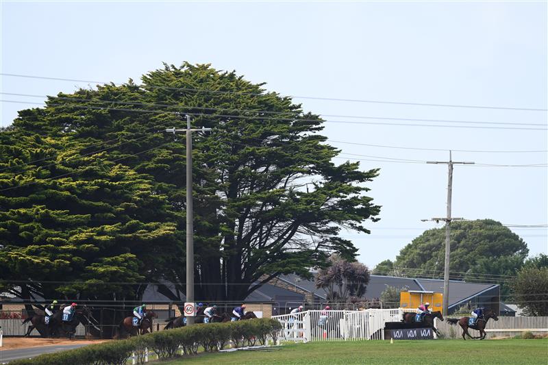 WARRNAMBOOL, AUSTRALIA - MAY 03: Horses and jockeys cross Moore Street as Tolemac ridden by Will Gordon wins the Decron Dunroe BM120 Steeplechase during Galleywood Hurdle day at Warrnambool Racing Club on May 03, 2023 in Warrnambool, Australia. (Photo by Morgan Hancock/Getty Images)