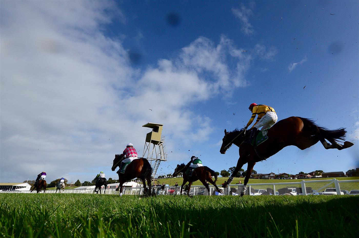 WARRNAMBOOL, AUSTRALIA - MAY 03: A general view of mud being flicked up from horses after they jumped over a hurdle in the Sovereign Resort Galleywood Hurdle during Galleywood Hurdle day at Warrnambool Racing Club on May 03, 2023 in Warrnambool, Australia. (Photo by Morgan Hancock/Getty Images)