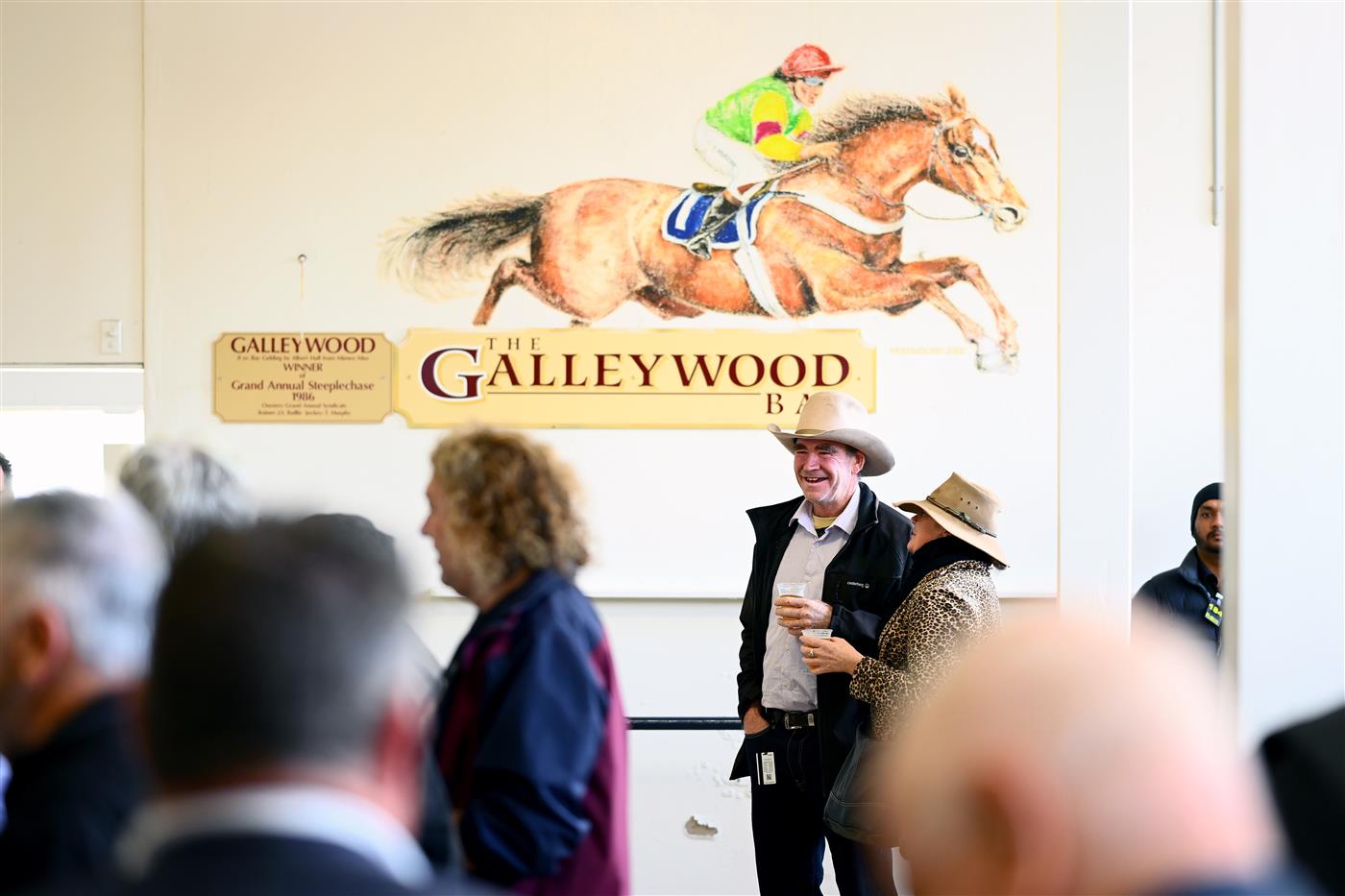 WARRNAMBOOL, AUSTRALIA - MAY 03: Punters stand in the Galleywood bar during Galleywood Hurdle day at Warrnambool Racing Club on May 03, 2023 in Warrnambool, Australia. (Photo by Morgan Hancock/Getty Images)