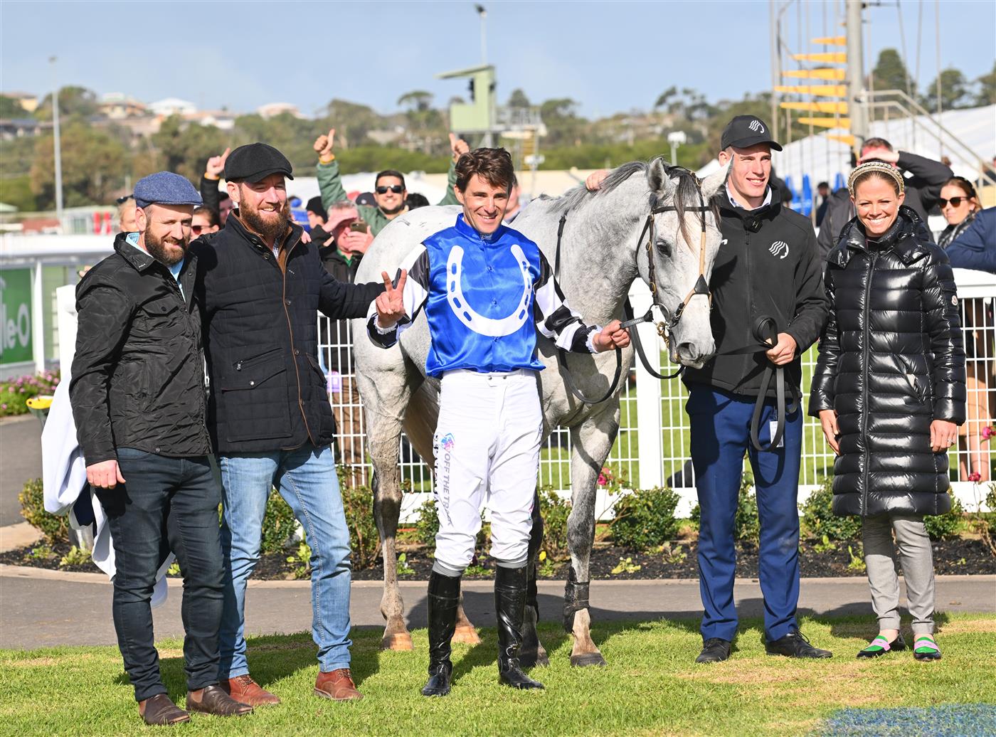 WARRNAMBOOL, AUSTRALIA - MAY 03: (L-R) Declan Mayer, Ciaron Maher, Steven Pateman, strapper and Jess Pateman pose after Saunter Boy won Race 6, the Sovereign Resort Galleywood Hurdle, during Galleywood Hurdle Day on May 03, 2023 in Warrnambool, Australia. (Photo by Vince Caligiuri/Getty Images)
