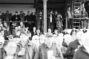 WARRNAMBOOL, AUSTRALIA - MAY 03: (EDITORS NOTE: Image has been converted to black and white.) Crowds watch on during Galleywood Hurdle day at Warrnambool Racing Club on May 03, 2023 in Warrnambool, Australia. (Photo by Morgan Hancock/Getty Images)